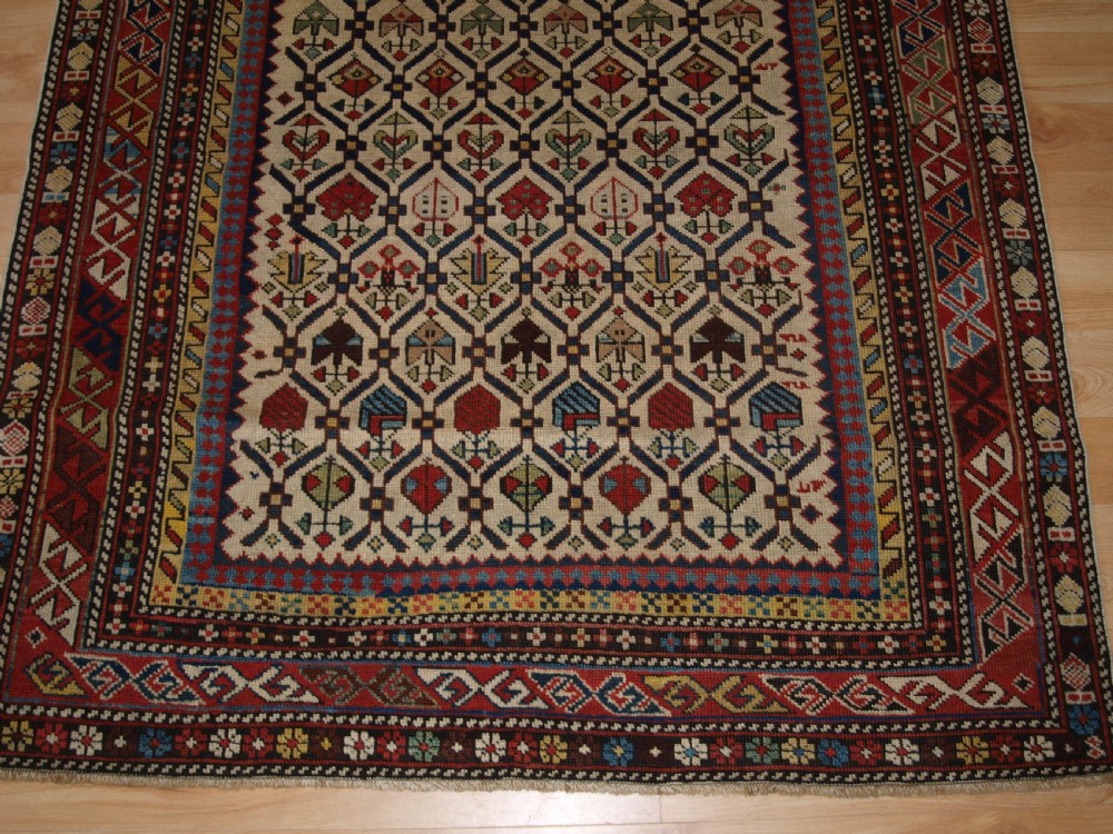 ANTIQUE CAUCASIAN DAGHESTAN RUG WITH IVORY GROUND FLORAL LATTICE, SUPERB, CIRCA 1880. View VI