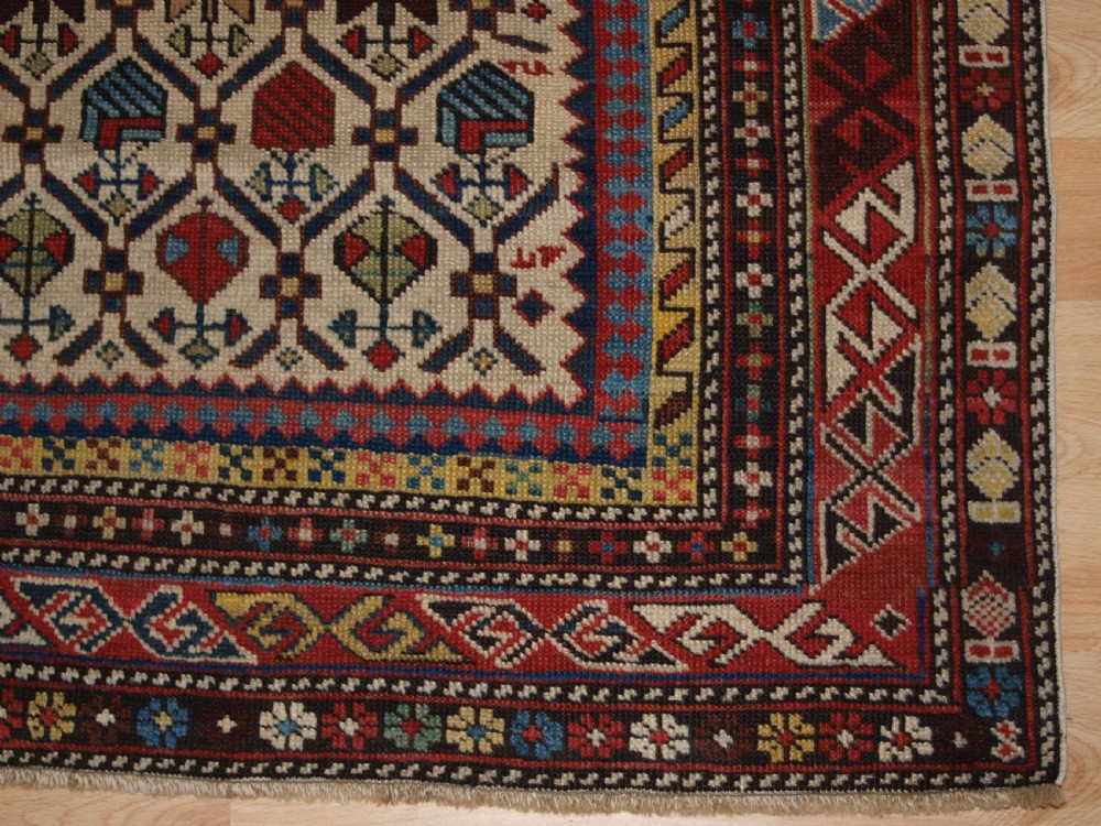 ANTIQUE CAUCASIAN DAGHESTAN RUG WITH IVORY GROUND FLORAL LATTICE, SUPERB, CIRCA 1880. View VII