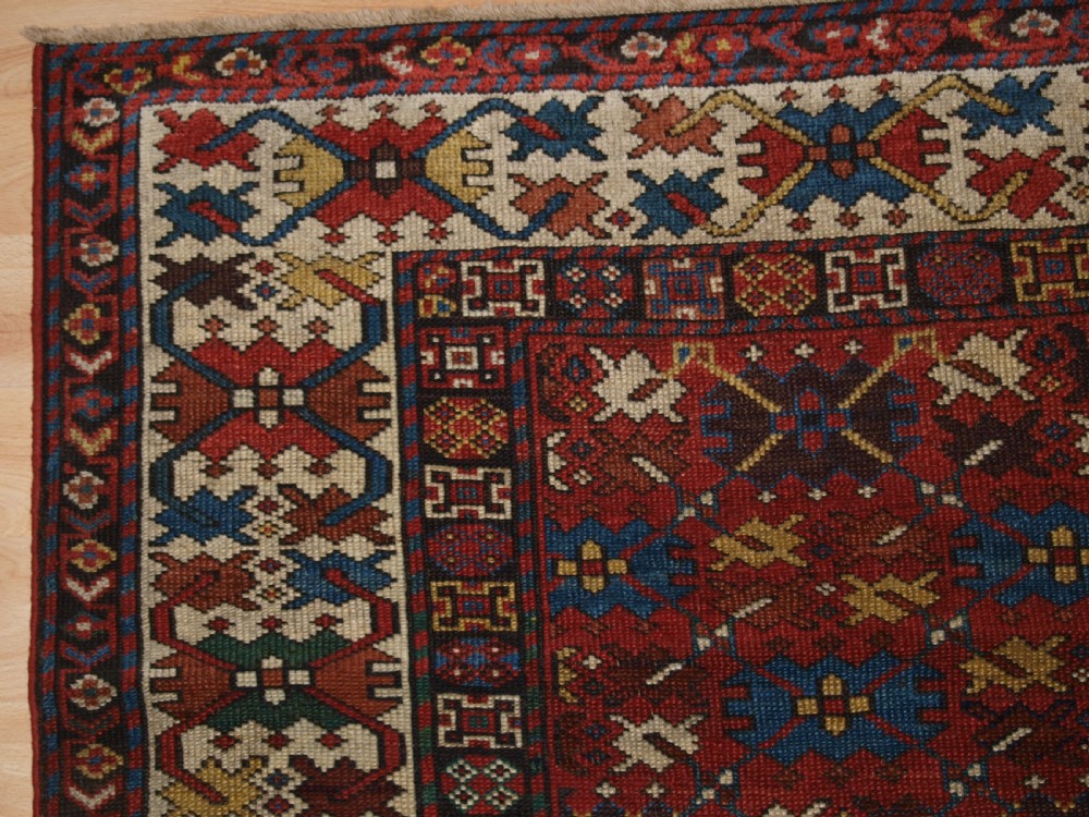 ANTIQUE CAUCASIAN SHIRVAN RUG, LATTICE DESIGN, GOOD COLOUR, DATED 1306 (1888). View II