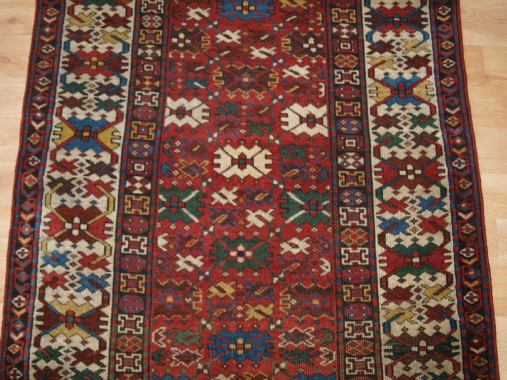 ANTIQUE CAUCASIAN SHIRVAN RUG, LATTICE DESIGN, GOOD COLOUR, DATED 1306 (1888). View IV