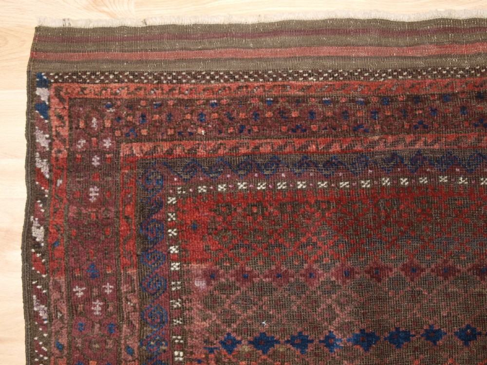 ANTIQUE BALUCH RUG WITH REPEAT DESIGN, COMPLETE KILIM ENDS, CIRCA 1900. View III