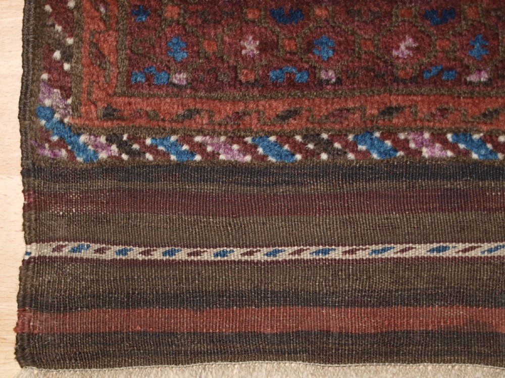 ANTIQUE BALUCH RUG WITH REPEAT DESIGN, COMPLETE KILIM ENDS, CIRCA 1900. View VII