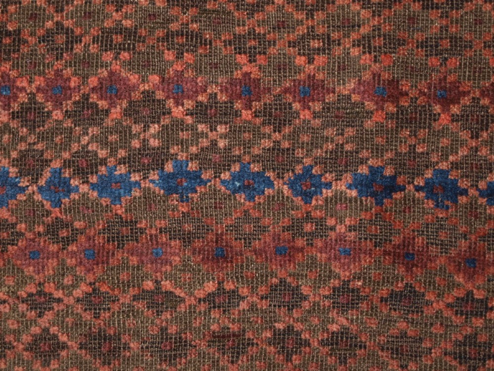 ANTIQUE BALUCH RUG WITH REPEAT DESIGN, COMPLETE KILIM ENDS, CIRCA 1900. View X