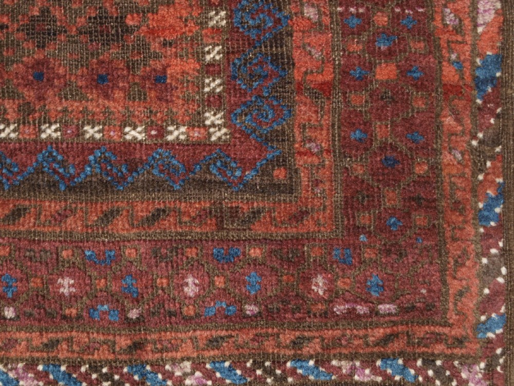 ANTIQUE BALUCH RUG WITH REPEAT DESIGN, COMPLETE KILIM ENDS, CIRCA 1900. View XI