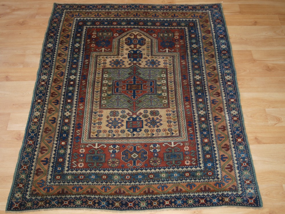 ANTIQUE CAUCASIAN DERBENT PRAYER RUG IN CLASSIC KAZAK PRAYER DESIGN, CIRCA 1900.