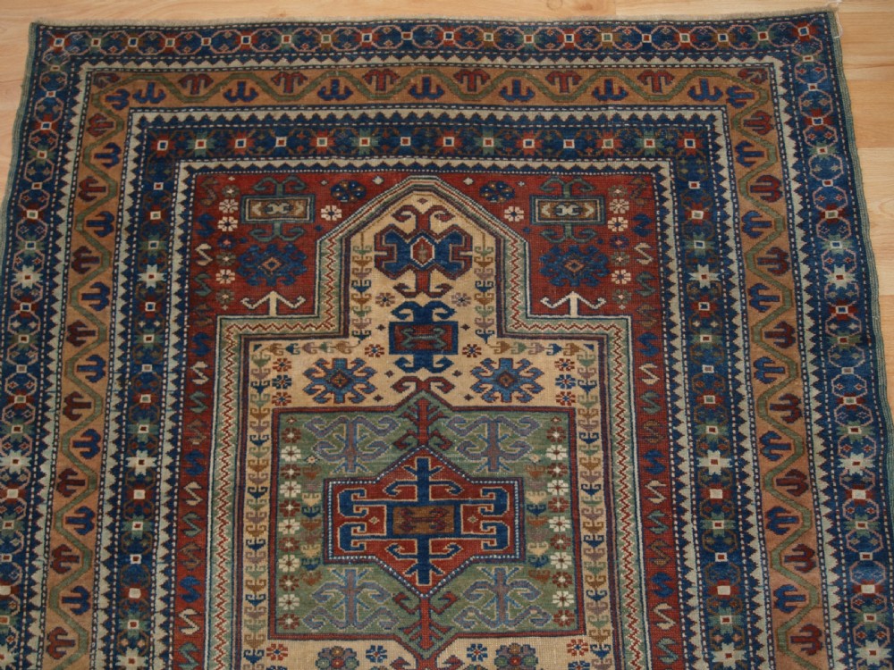 ANTIQUE CAUCASIAN DERBENT PRAYER RUG IN CLASSIC KAZAK PRAYER DESIGN, CIRCA 1900. View III
