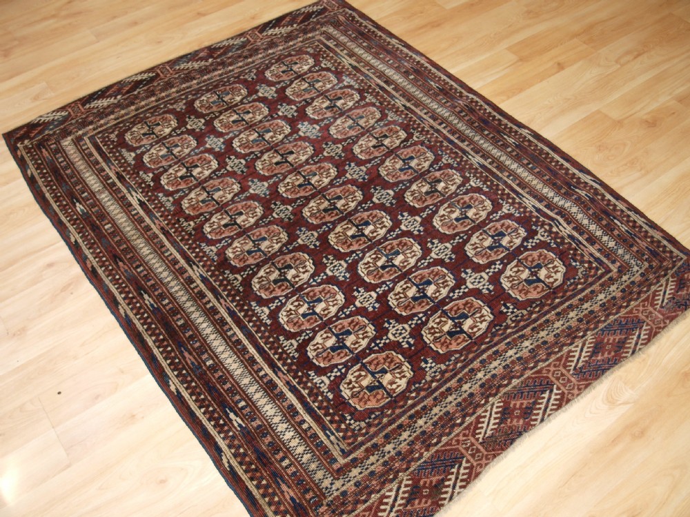 ANTIQUE TEKKE TURKMEN RUG OF SMALL SIZE, RICH RED BROWN COLOUR, CIRCA 1900. View II