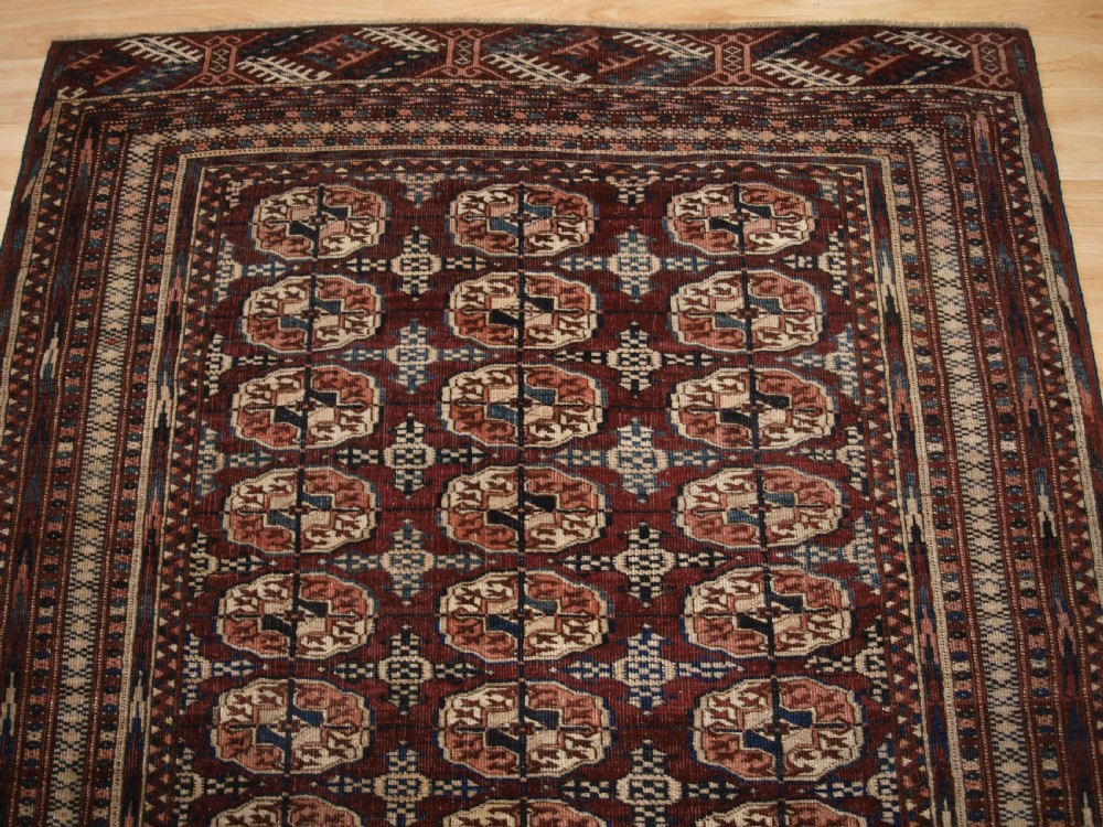 ANTIQUE TEKKE TURKMEN RUG OF SMALL SIZE, RICH RED BROWN COLOUR, CIRCA 1900. View IV