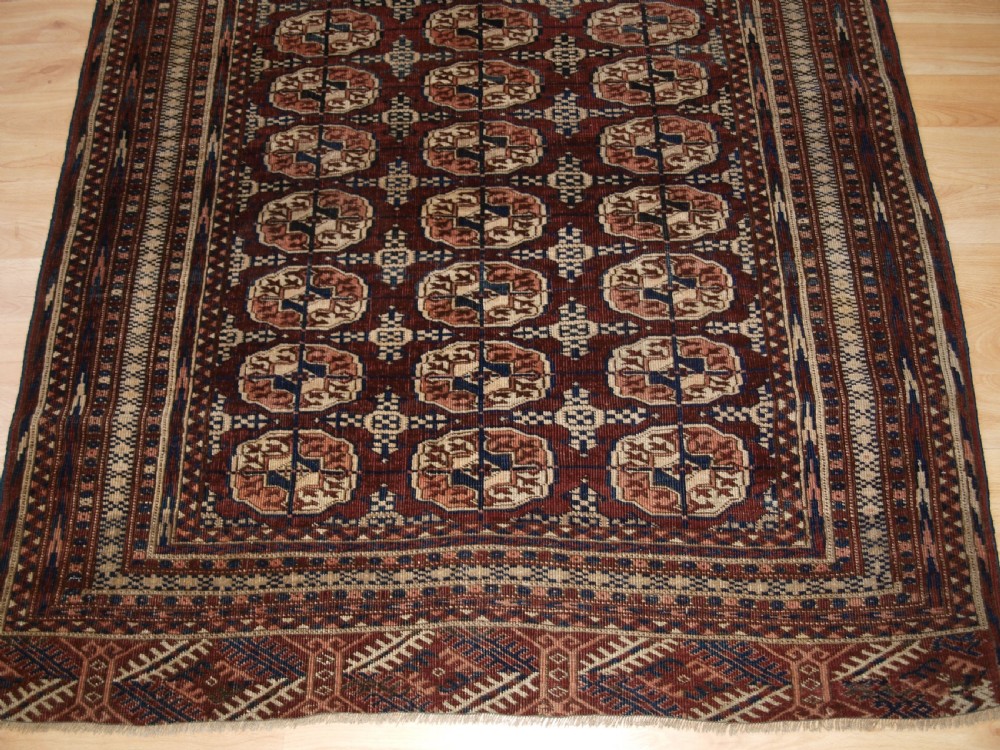 ANTIQUE TEKKE TURKMEN RUG OF SMALL SIZE, RICH RED BROWN COLOUR, CIRCA 1900. View VI