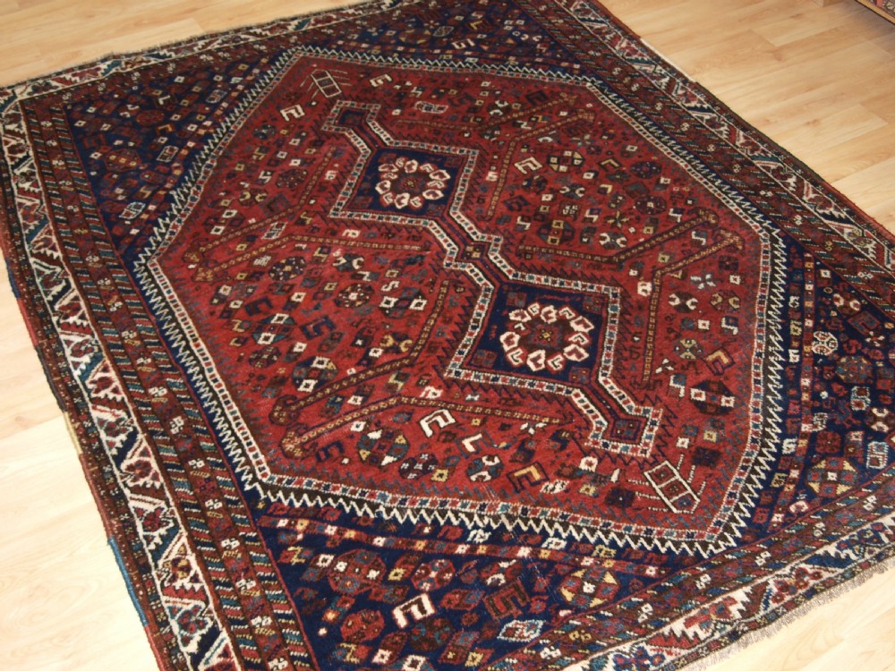 OLD SHIRAZ REGION RUG, TRIBAL DESIGN, CIRCA 1920. View II