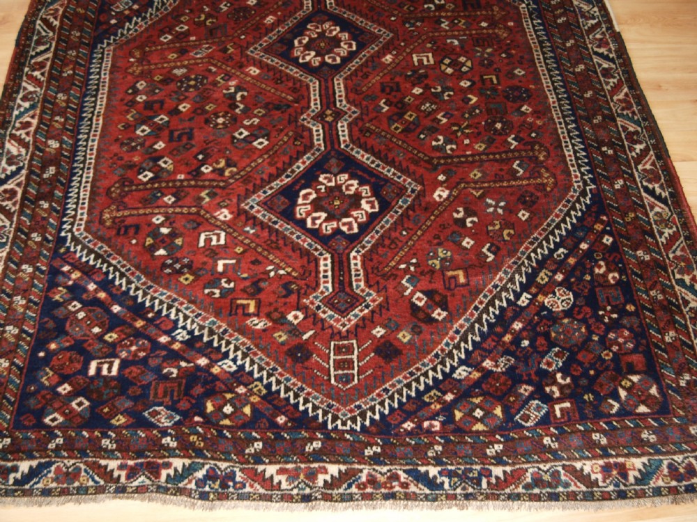 OLD SHIRAZ REGION RUG, TRIBAL DESIGN, CIRCA 1920. View VI