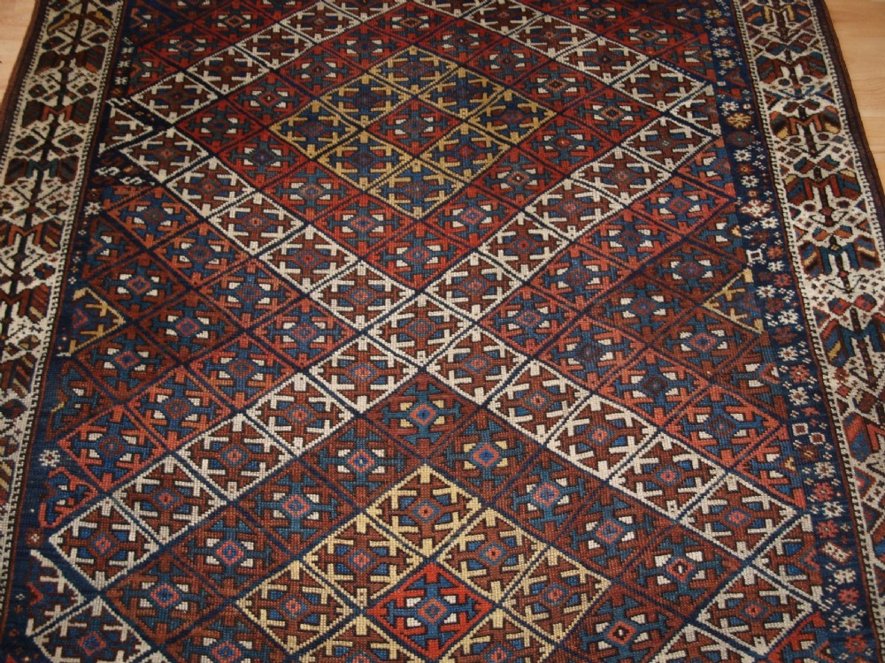 ANTIQUE KURDISH RUG WITH LATTICE DESIGN, VISUALLY STRIKING RUG, CIRCA 1900. View V