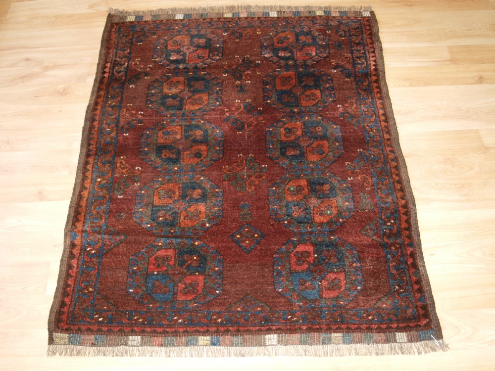 ANTIQUE ERSARI TURKMEN RUG OF SMALL SIZE, EARTH COLOURS, CIRCA 1900.