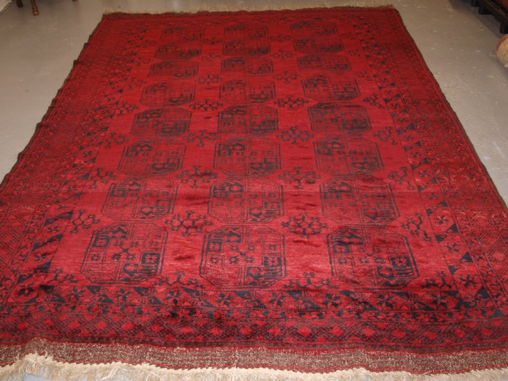 OLD RED AFGHAN VILLAGE CARPET, SLIGHT TENSION PROBLEM HENCE THE LOW PRICE, CIRCA 1920. View II