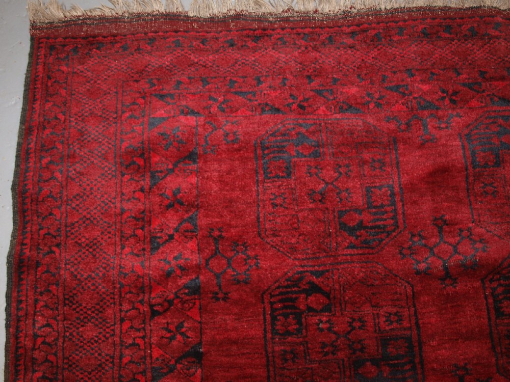 OLD RED AFGHAN VILLAGE CARPET, SLIGHT TENSION PROBLEM HENCE THE LOW PRICE, CIRCA 1920. View III
