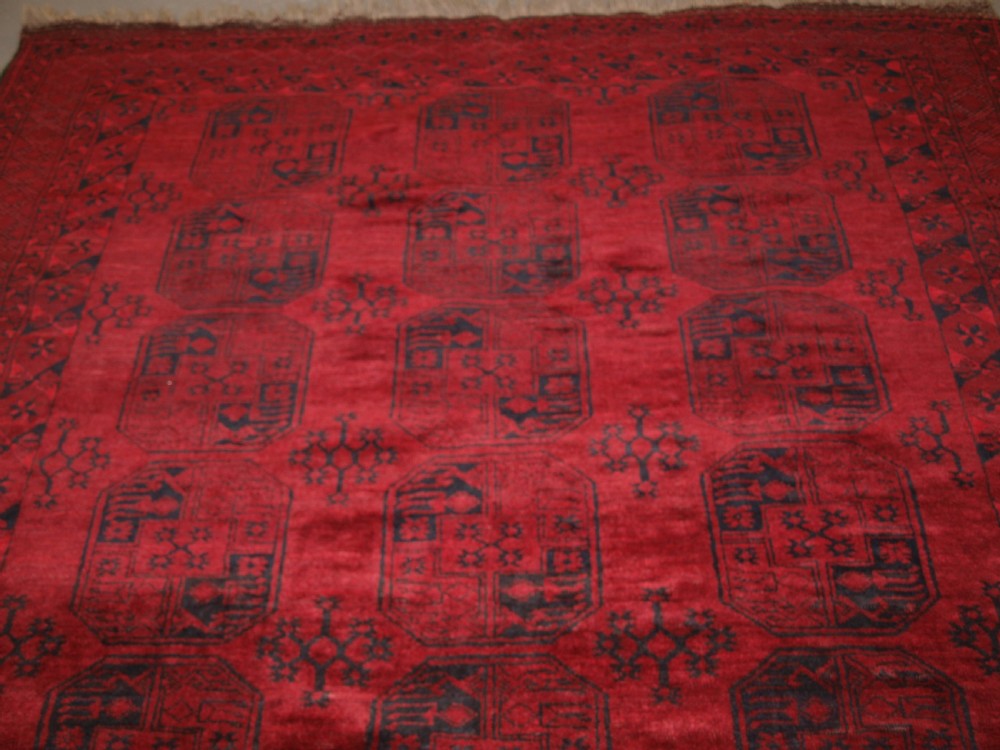 OLD RED AFGHAN VILLAGE CARPET, SLIGHT TENSION PROBLEM HENCE THE LOW PRICE, CIRCA 1920. View IV