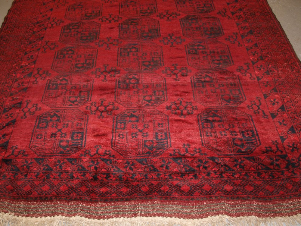 OLD RED AFGHAN VILLAGE CARPET, SLIGHT TENSION PROBLEM HENCE THE LOW PRICE, CIRCA 1920. View V