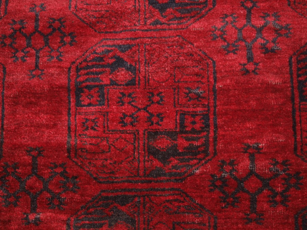 OLD RED AFGHAN VILLAGE CARPET, SLIGHT TENSION PROBLEM HENCE THE LOW PRICE, CIRCA 1920. View VI