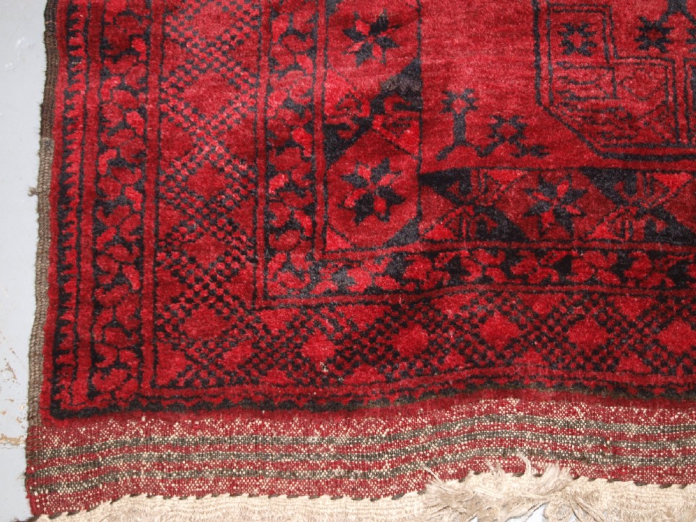 OLD RED AFGHAN VILLAGE CARPET, SLIGHT TENSION PROBLEM HENCE THE LOW PRICE, CIRCA 1920. View VIII