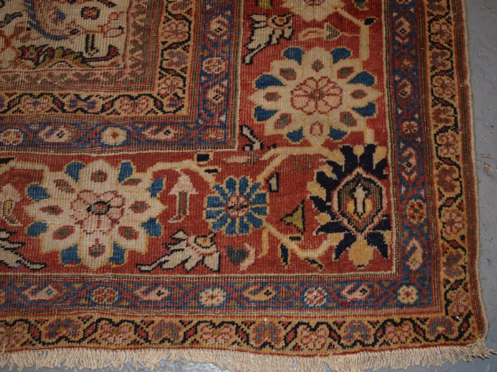 An antique Persian Mahal wool carpet featuring an all-over floral lattice pattern on an ivory ground, framed by a wide terracotta and navy border. View IX