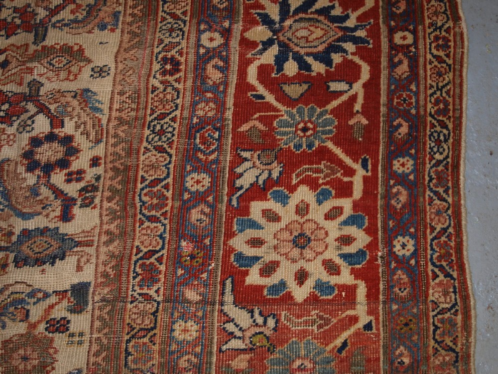 An antique Persian Mahal wool carpet featuring an all-over floral lattice pattern on an ivory ground, framed by a wide terracotta and navy border. View XI