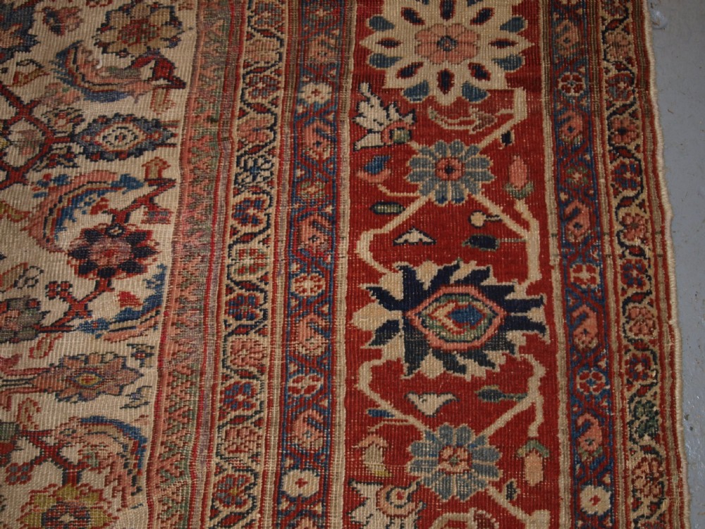 An antique Persian Mahal wool carpet featuring an all-over floral lattice pattern on an ivory ground, framed by a wide terracotta and navy border. View XIII