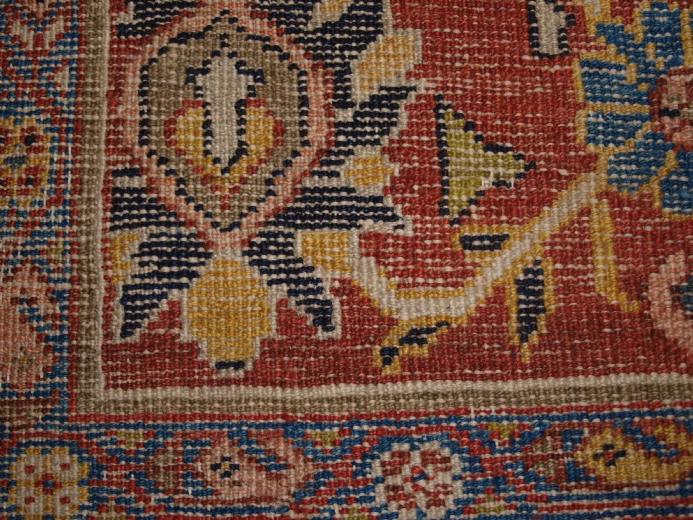 An antique Persian Mahal wool carpet featuring an all-over floral lattice pattern on an ivory ground, framed by a wide terracotta and navy border. View XV