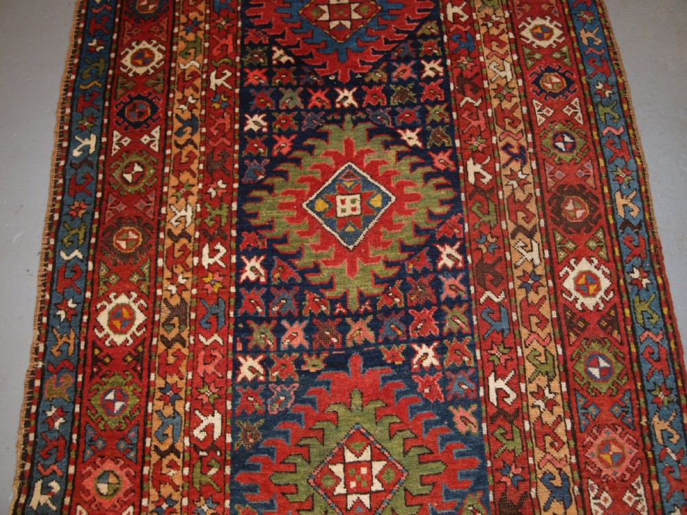 ANTIQUE CAUCASIAN LONG RUG OR RUNNER WITH MEDALLION DESIGN, SUPERB COLOURS, CIRCA 1900. View IV