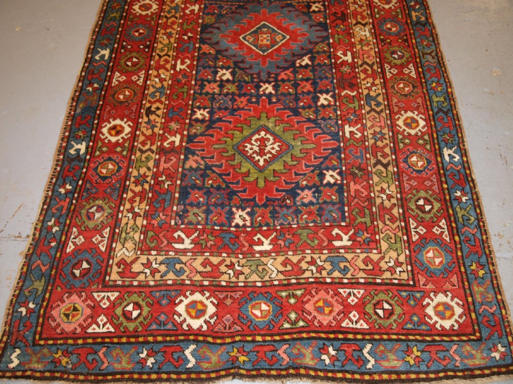 ANTIQUE CAUCASIAN LONG RUG OR RUNNER WITH MEDALLION DESIGN, SUPERB COLOURS, CIRCA 1900. View VI