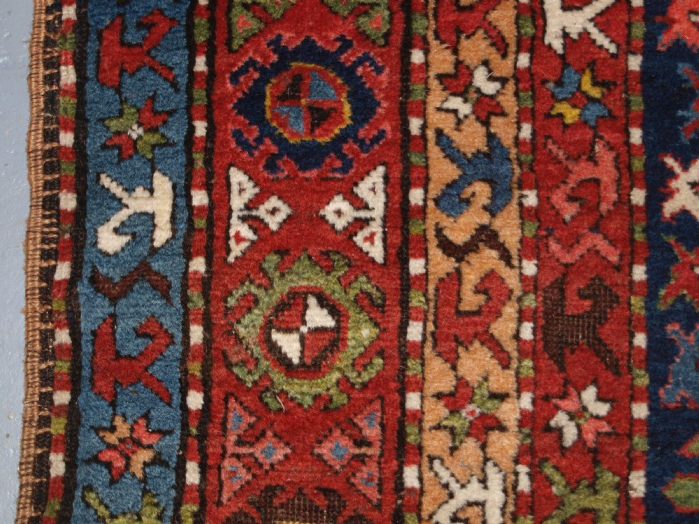 ANTIQUE CAUCASIAN LONG RUG OR RUNNER WITH MEDALLION DESIGN, SUPERB COLOURS, CIRCA 1900. View IX