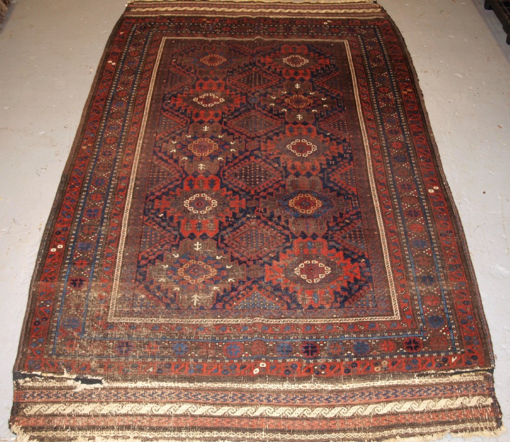 ANTIQUE TIMURI BALUCH MAIN CARPET, OUTSTANDING COLOUR, EX WISDOM COLLECTION. 2ND HALF 19TH CENTURY.