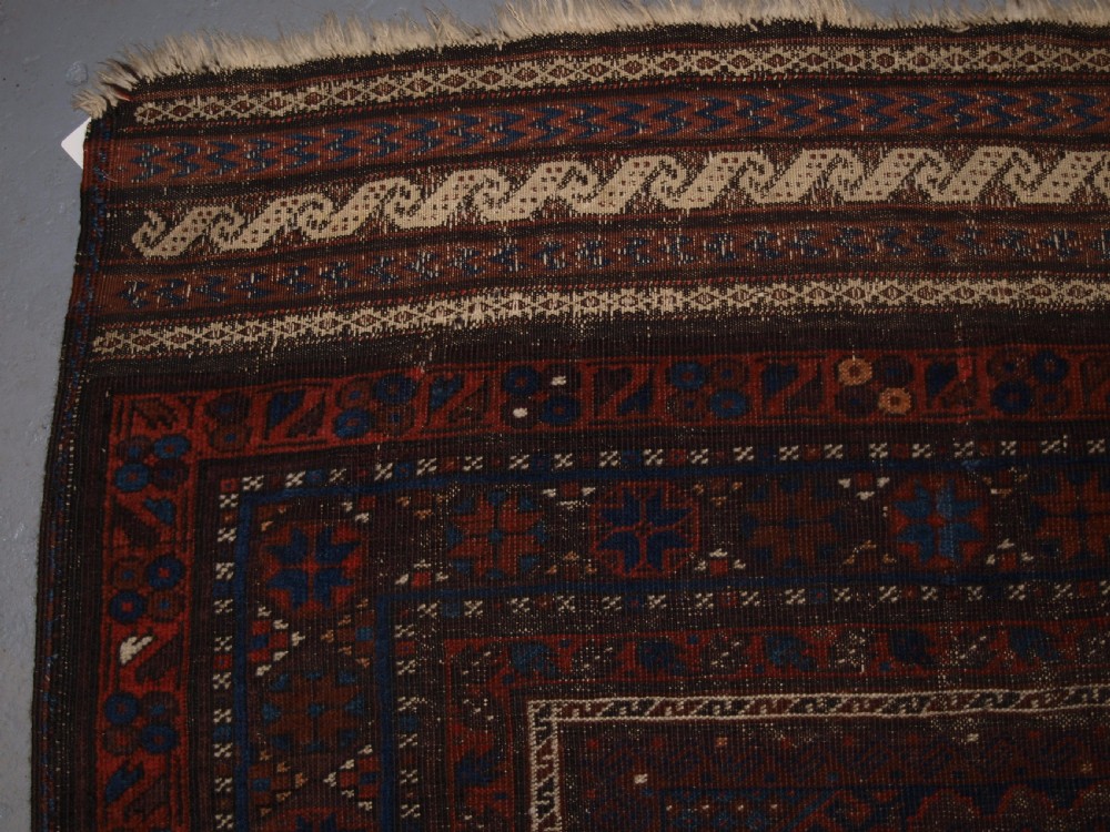 ANTIQUE TIMURI BALUCH MAIN CARPET, OUTSTANDING COLOUR, EX WISDOM COLLECTION. 2ND HALF 19TH CENTURY. View II
