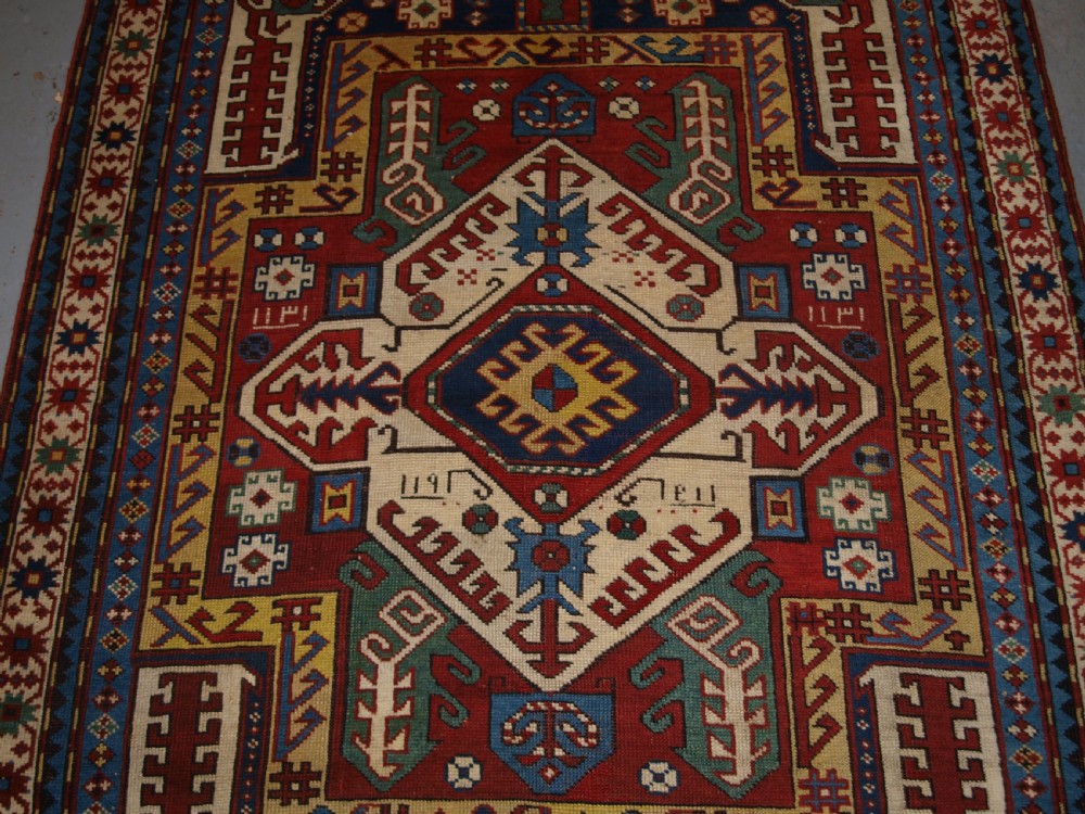 ANTIQUE CAUCASIAN KASIM-USAG RUG, CLASSIC DESIGN WITH SUPERB COLOUR, DATED, 1893. View IV