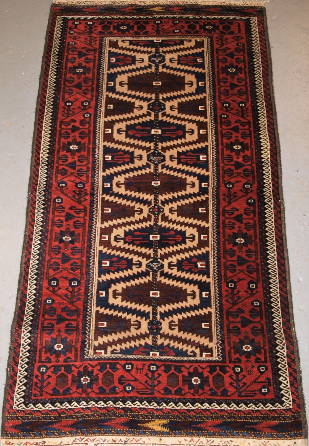 ANTIQUE BALUCH RUG, KHORASSAN REGION, NORTH EAST PERSIA, LATE 19TH CENTURY.
