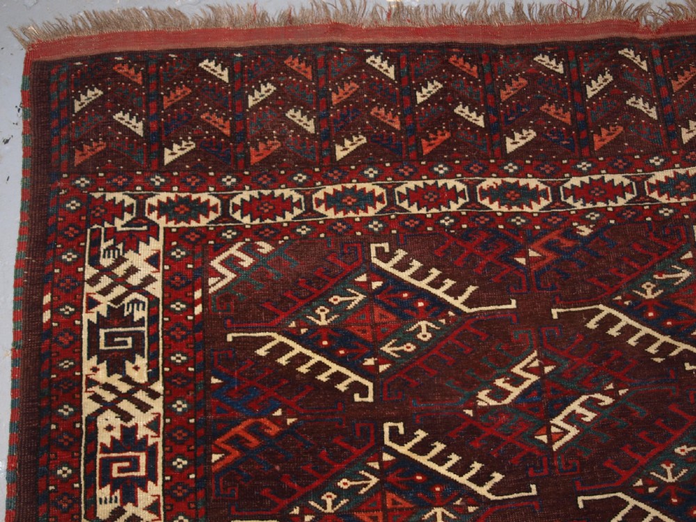 ANTIQUE YOMUT TURKMEN MAIN CARPET WITH DYRNAK GUL DESIGN, CURL LEAF BORDER, CIRCA 1880. View II