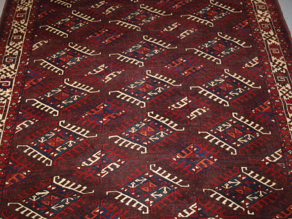 ANTIQUE YOMUT TURKMEN MAIN CARPET WITH DYRNAK GUL DESIGN, CURL LEAF BORDER, CIRCA 1880. View V