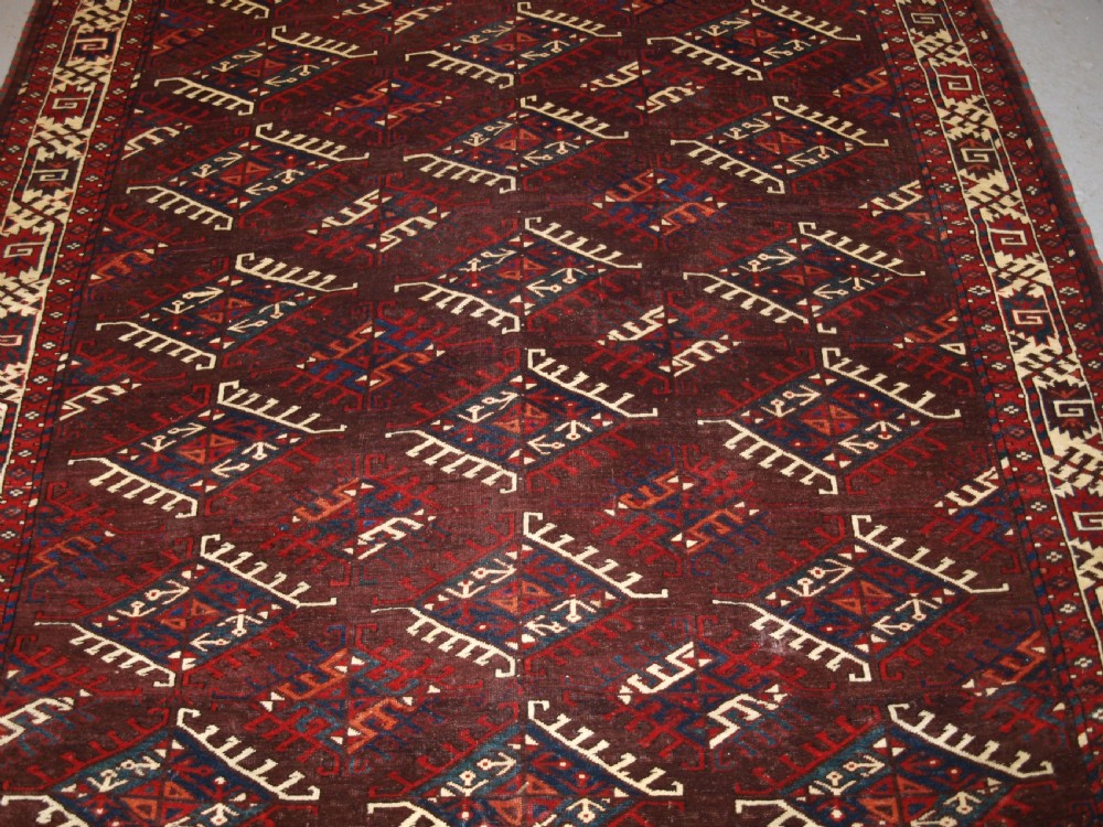 ANTIQUE YOMUT TURKMEN MAIN CARPET WITH DYRNAK GUL DESIGN, CURL LEAF BORDER, CIRCA 1880. View VI