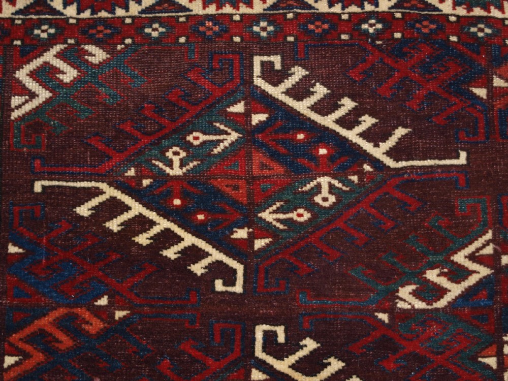 ANTIQUE YOMUT TURKMEN MAIN CARPET WITH DYRNAK GUL DESIGN, CURL LEAF BORDER, CIRCA 1880. View VII