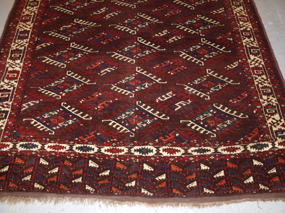 ANTIQUE YOMUT TURKMEN MAIN CARPET WITH DYRNAK GUL DESIGN, CURL LEAF BORDER, CIRCA 1880. View VIII