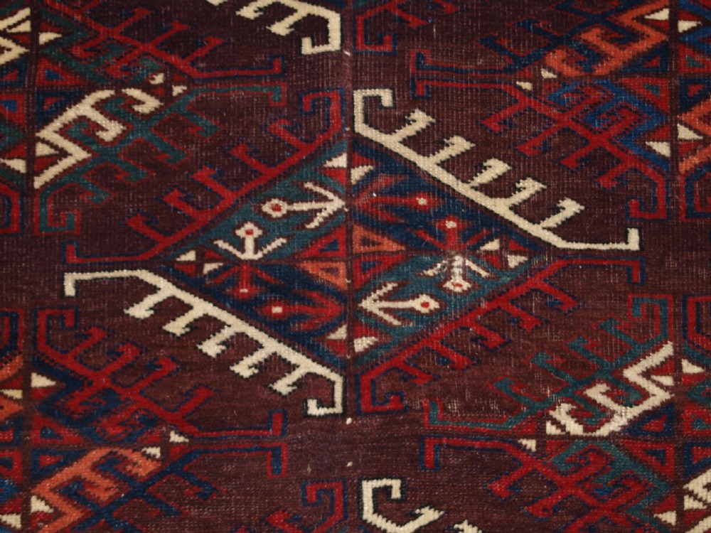 ANTIQUE YOMUT TURKMEN MAIN CARPET WITH DYRNAK GUL DESIGN, CURL LEAF BORDER, CIRCA 1880. View IX