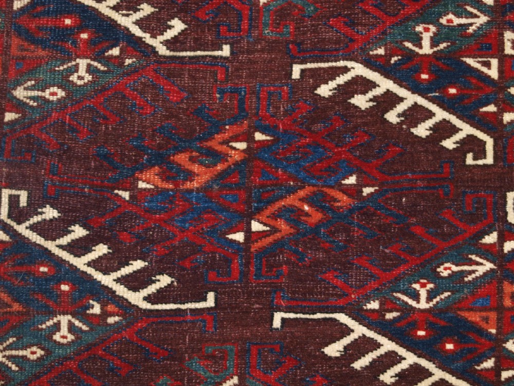 ANTIQUE YOMUT TURKMEN MAIN CARPET WITH DYRNAK GUL DESIGN, CURL LEAF BORDER, CIRCA 1880. View X