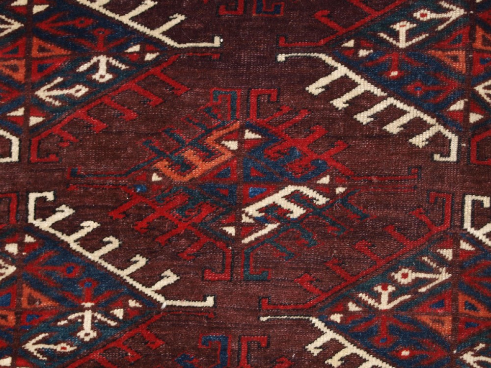 ANTIQUE YOMUT TURKMEN MAIN CARPET WITH DYRNAK GUL DESIGN, CURL LEAF BORDER, CIRCA 1880. View XI
