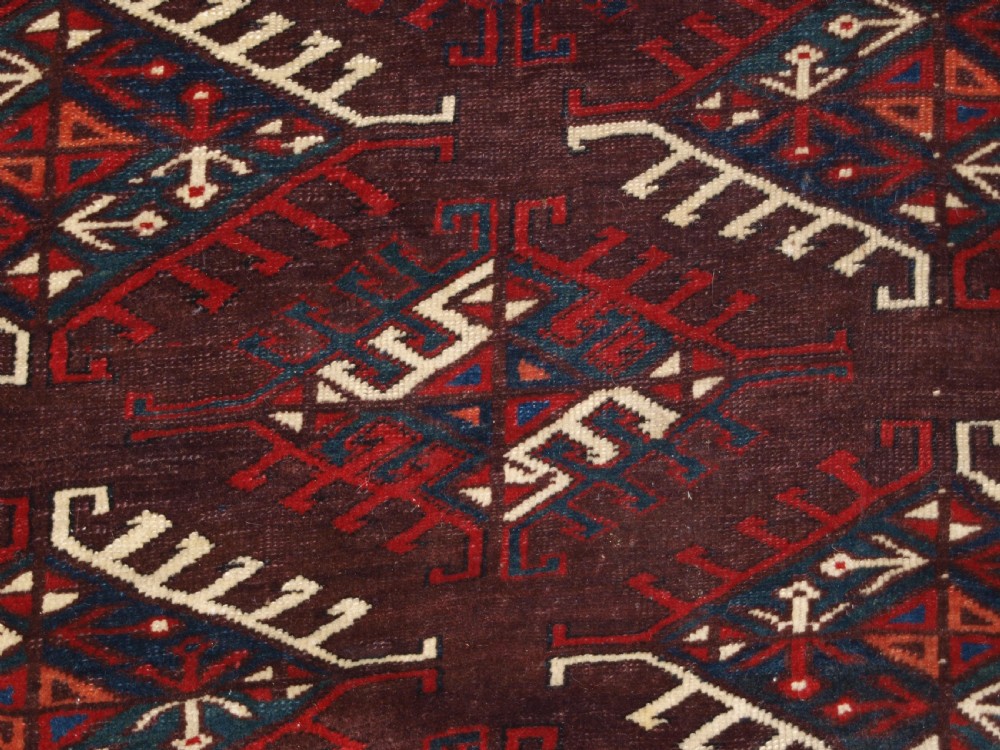 ANTIQUE YOMUT TURKMEN MAIN CARPET WITH DYRNAK GUL DESIGN, CURL LEAF BORDER, CIRCA 1880. View XII