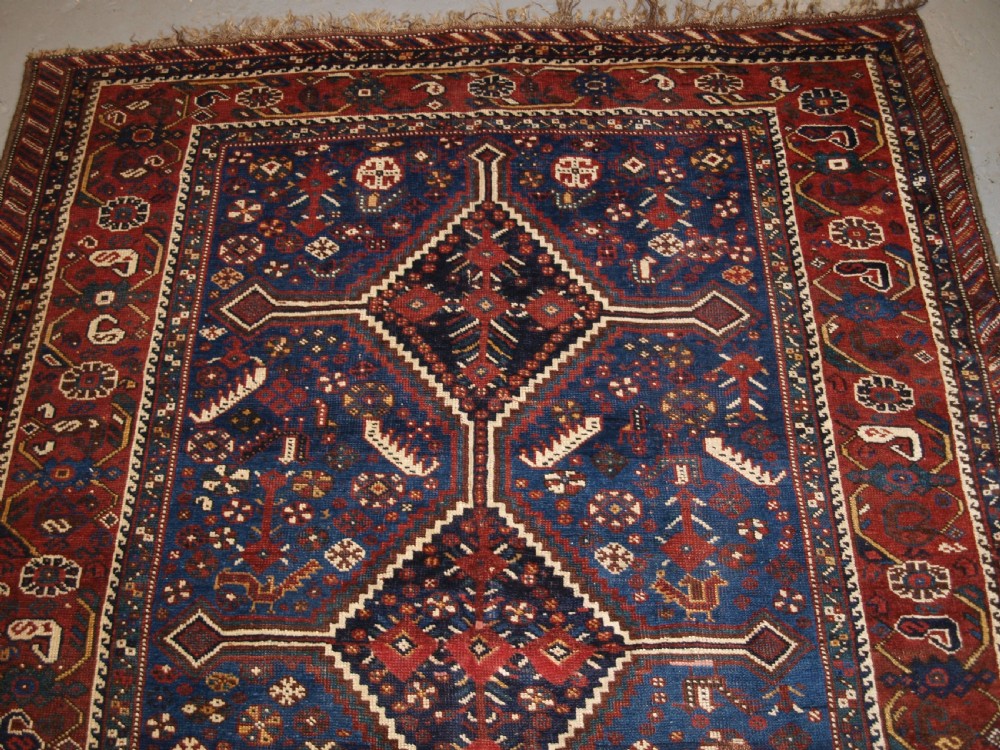 ANTIQUE TRIBAL KHAMSEH RUG, TRIPLE LINKED MEDALLION, CIRCA 1900. View IV