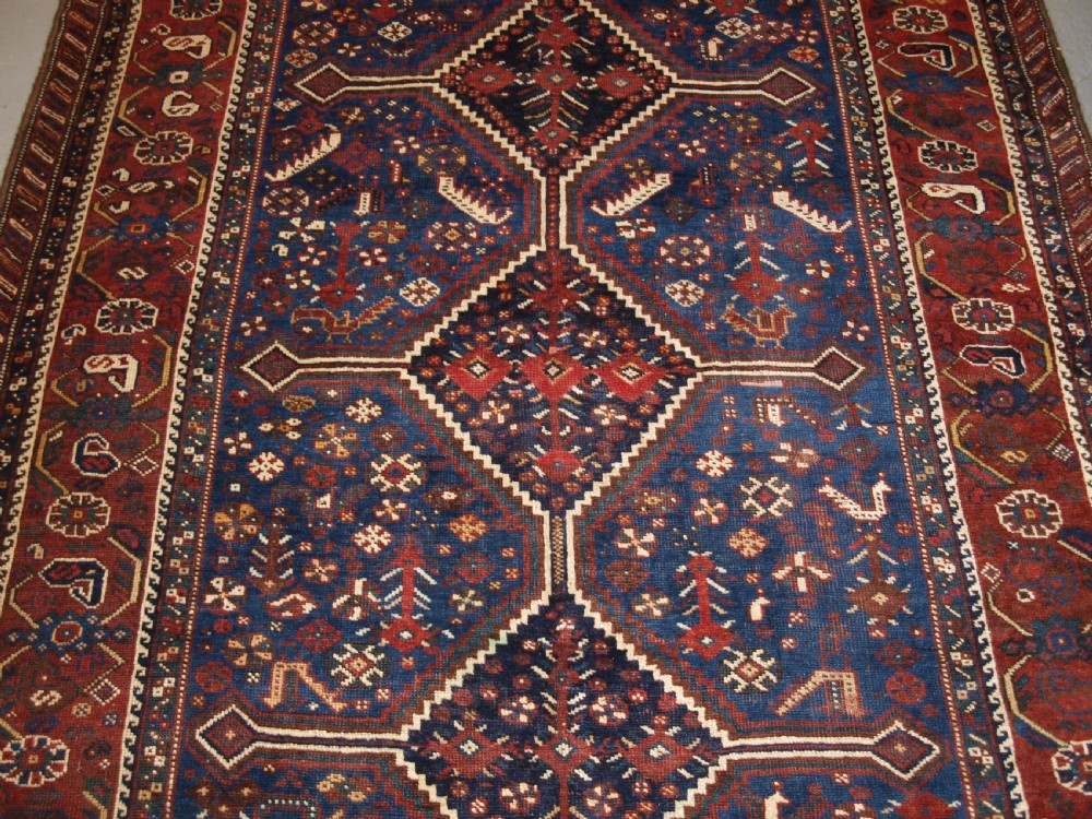 ANTIQUE TRIBAL KHAMSEH RUG, TRIPLE LINKED MEDALLION, CIRCA 1900. View V