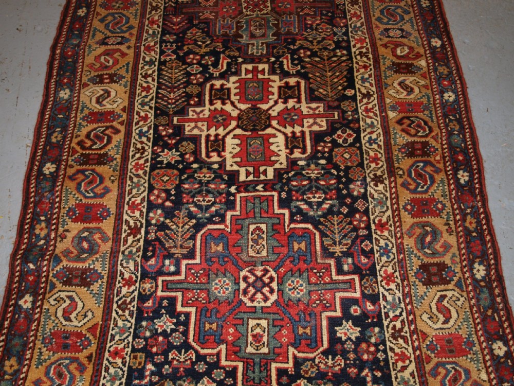 ANTIQUE KURDISH LONG RUG WITH MEDALLION DESIGN, SUPERB COLOUR, CIRCA 1880. View VI