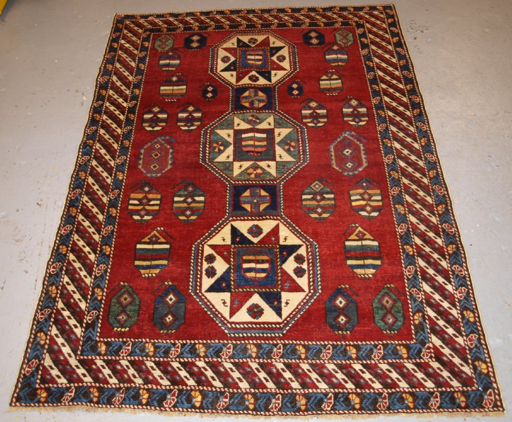 ANTIQUE CAUCASIAN SHIRVAN RUG WITH UNUSUAL STAR DESIGN, LATE 19TH CENTURY.