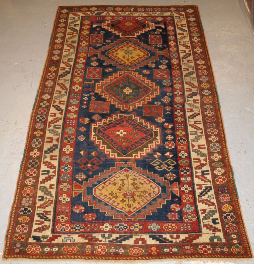 ANTIQUE CAUCASIAN KAZAK RUG, FIVE MEDALLION DESIGN, GREAT COLOURS, CIRCA 1880.