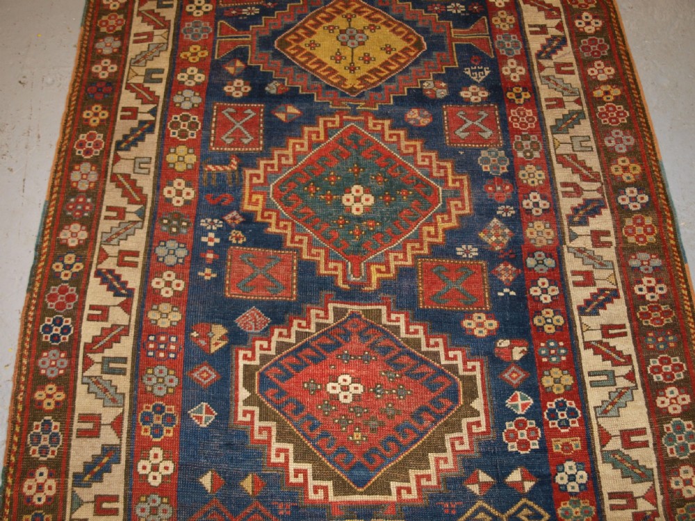 ANTIQUE CAUCASIAN KAZAK RUG, FIVE MEDALLION DESIGN, GREAT COLOURS, CIRCA 1880. View V