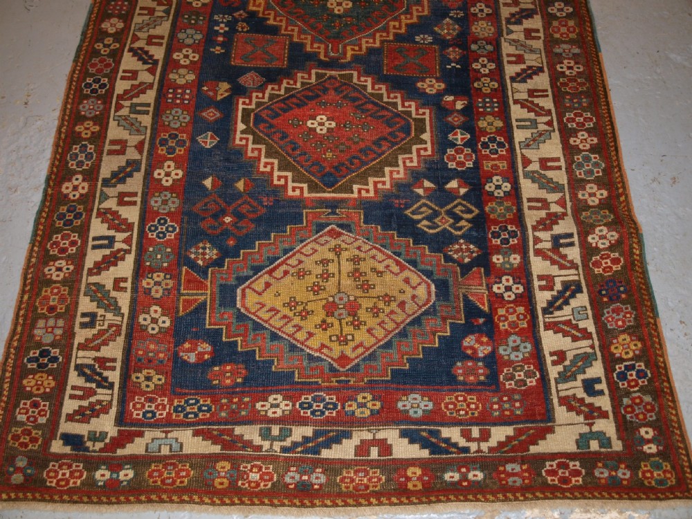 ANTIQUE CAUCASIAN KAZAK RUG, FIVE MEDALLION DESIGN, GREAT COLOURS, CIRCA 1880. View VI